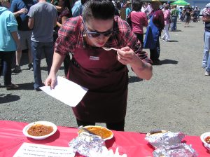 Chef Dakota Weiss tastes the chili.